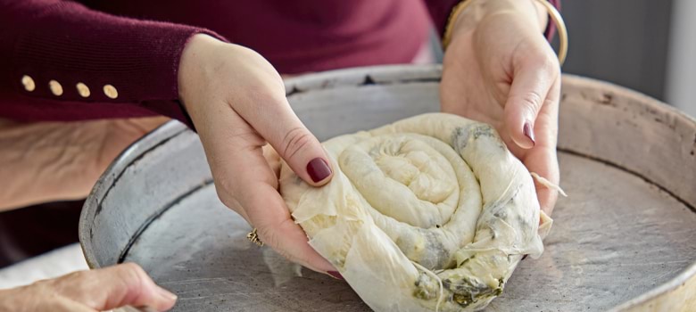 Jackson prepares Maznik, a traditional Macedonian pastry.