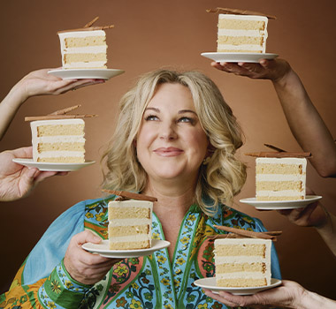 Australian chef Kirsten Tibball surrounded by cake