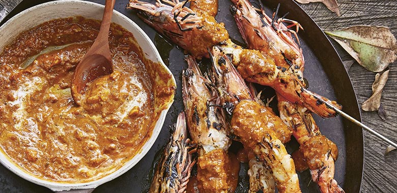 Prawns on skewers served with a bowl of macadamia satay prepared by Mindy Woods