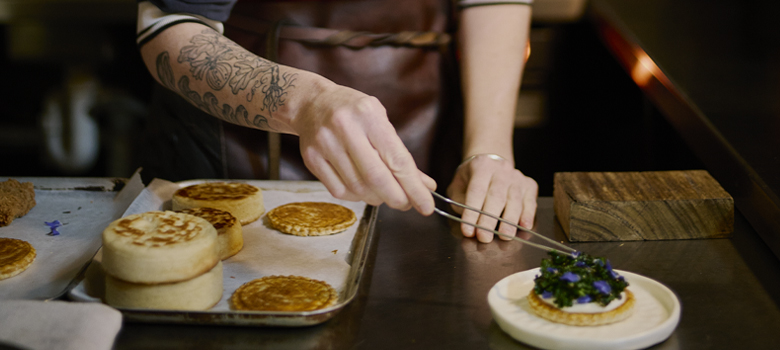 Zoe Birch garnishing macadamia tart