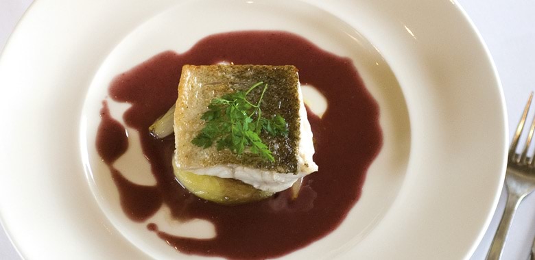 Pan-fried fillet of Murray cod with roasted shallots and red wine