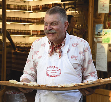 The legendary Dario Cecchini welcomes guests to his restaurant