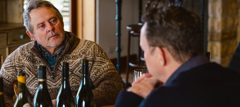 Selector Publisher Paul Diamond and Winemaker Stefano Lubiana at a table discussing the wines in front of them