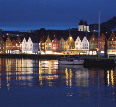 Norwegian town houses along the water at night