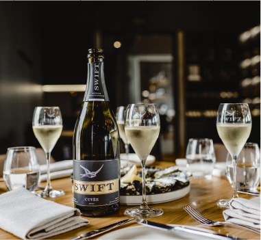 Printhe's sparkling wine labeled Swift on a restaurant table