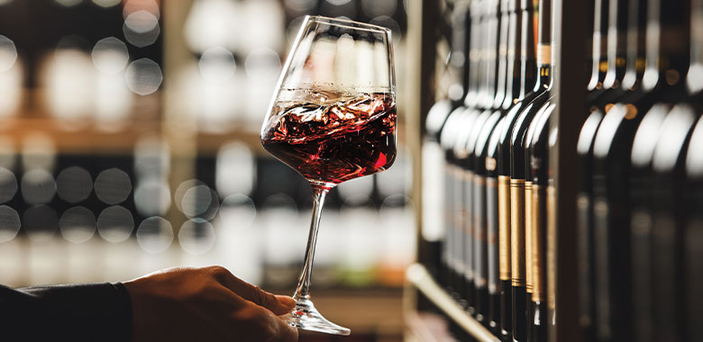 Swirling a glass of wine at a wine tasting