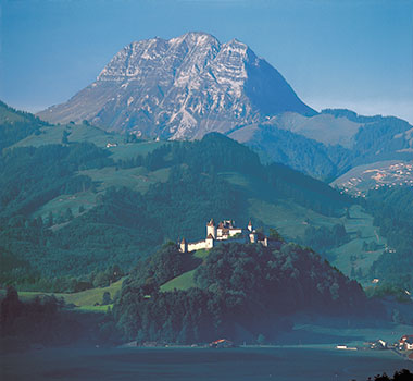 Gruyères Castle, nestled in the spectacular Alpine landscape of Switzerland.