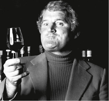 Len Evans in his youth tasting a glass of wine