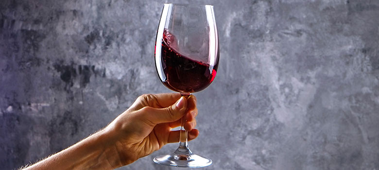Wine tasting Tempranillo - swirling wine in a glass