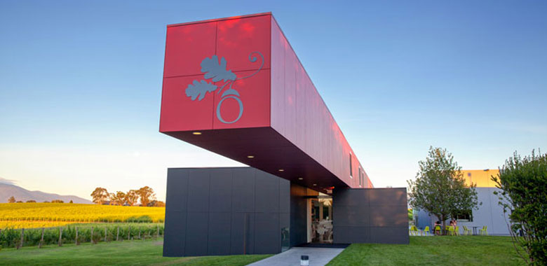 Outlook of the Oakridge Wines vineyard in Yarra Valley, featuring sleek industrial lines, the striking architect-designed building is in contrast the the surrounding vines