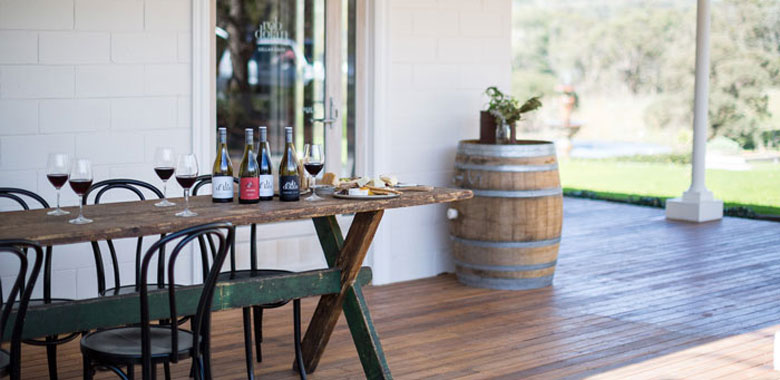 Rob Dolan cellar door and winery experience featuring red wines and a cheese board in the Yarra Valley