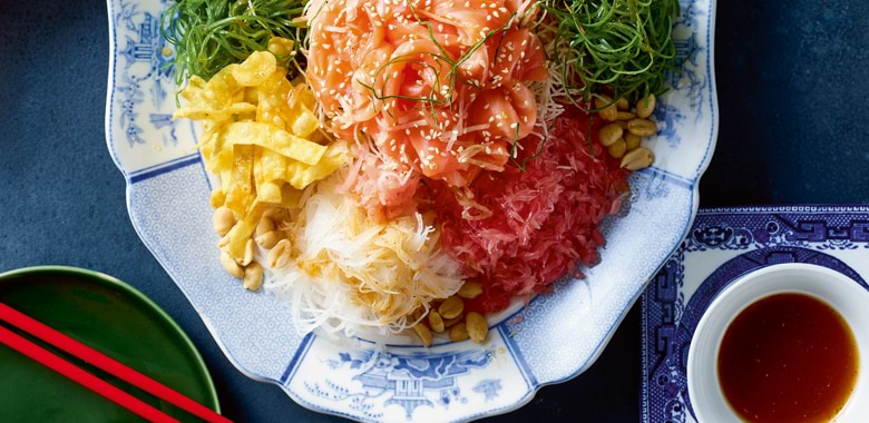 Chef Tony Tan's prosperity toss recipe, a colourful dish served on a classic blue and white plate, for Selector magazine
