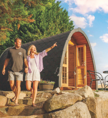 A couple enjoying a stay at the new glamping cabins at Stanthorpe Holiday Park.