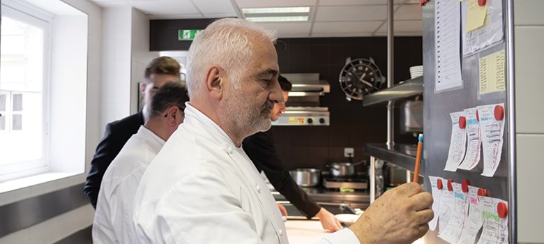 French chef Guy Savoy at the pass in his restaurant kitchen (image by Laurence Mouton)