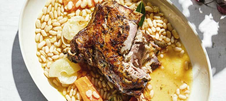 Slow-roasted lamb shoulder with white beans and harissa