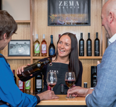 People enjoying a glass of wine at the Tasting Bar of Zema Estate Cellar Door