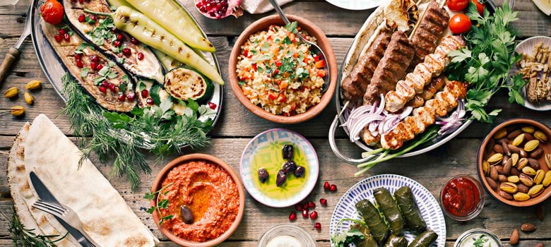 Mediterranean Greek cuisine spread across table ready to be enjoyed